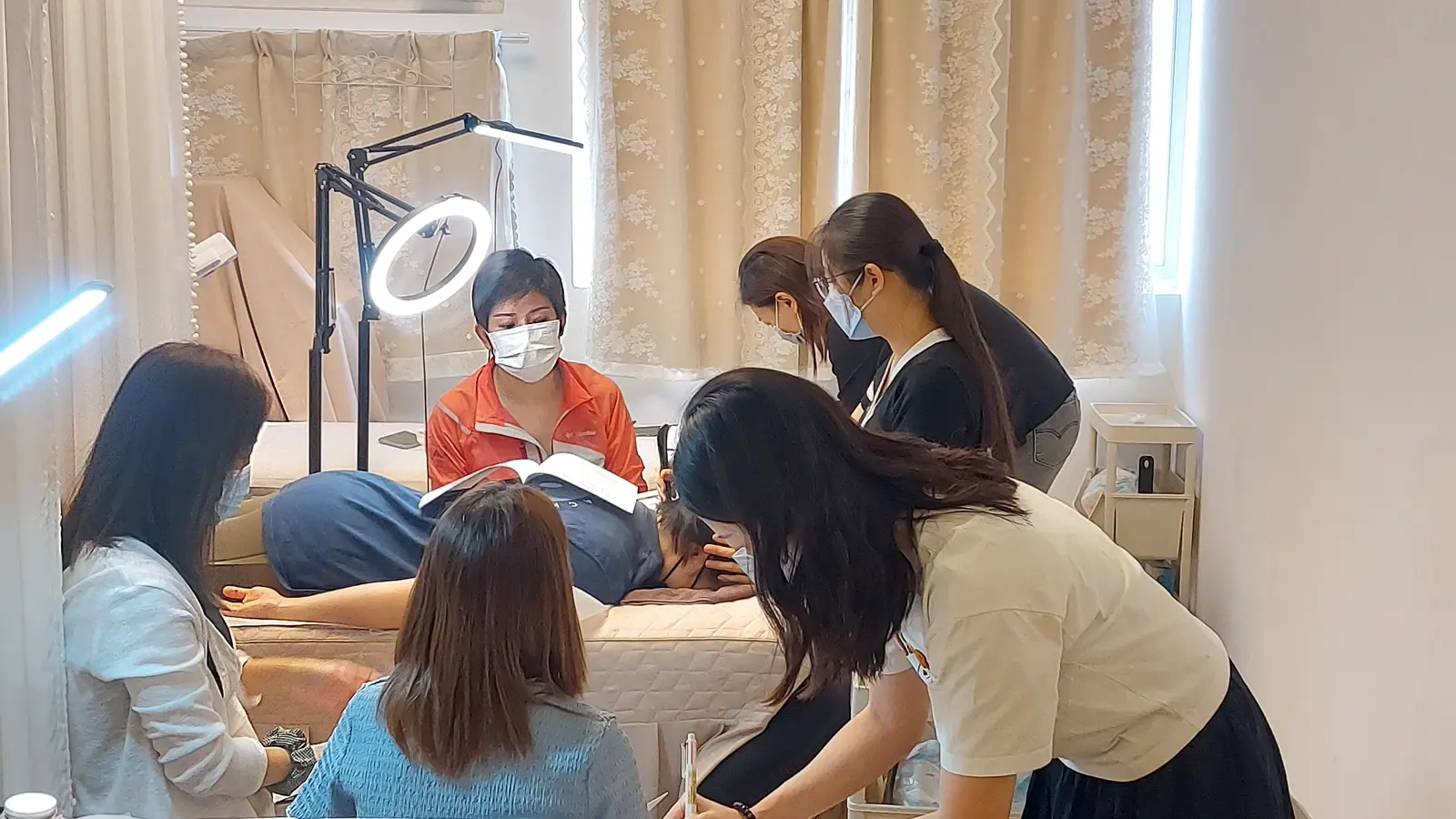 A small group reviewing bojin technique together during a practice session